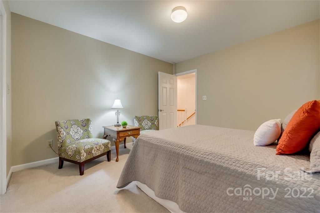 29008 Silver Fox Drive Tega Cay, SC 29708 - Photo 32 of 48 a bed room with a bed and a couch