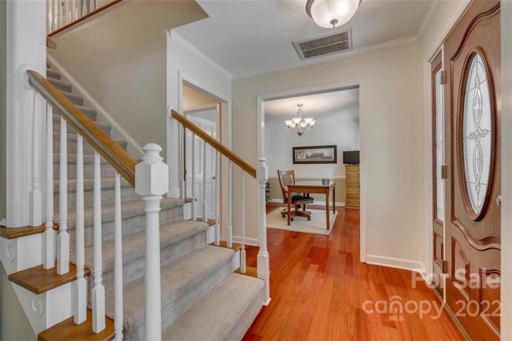 29008 Silver Fox Drive Tega Cay, SC 29708 - Photo 5 of 48 a view of entryway and hall with wooden floor