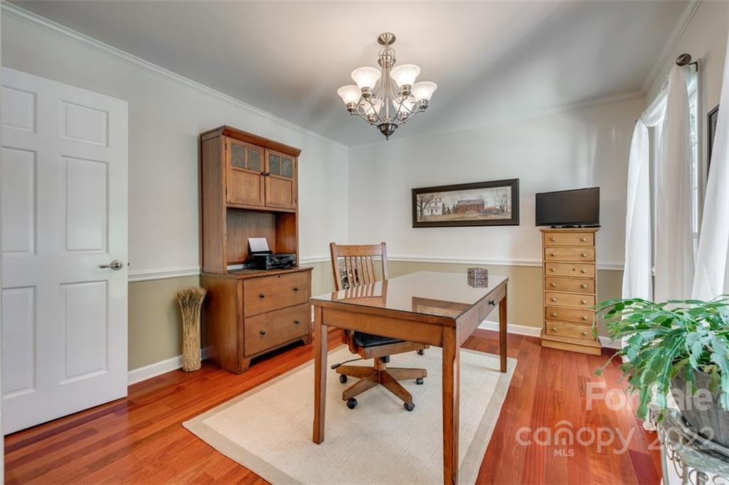 29008 Silver Fox Drive Tega Cay, SC 29708 - Photo 6 of 48 a view of a workspace with furniture and a chandelier