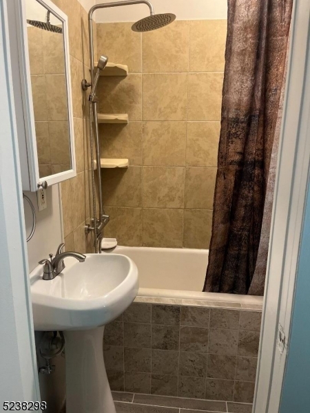 80 Main Street, Unit 3 Franklin, NJ 07416 - Photo 7 of 9 a bathroom with a sink and shower