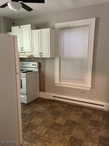 80 Main Street, Unit 3 Franklin, NJ 07416 - Photo 8 of 9 a kitchen with granite countertop a refrigerator sink and cabinets