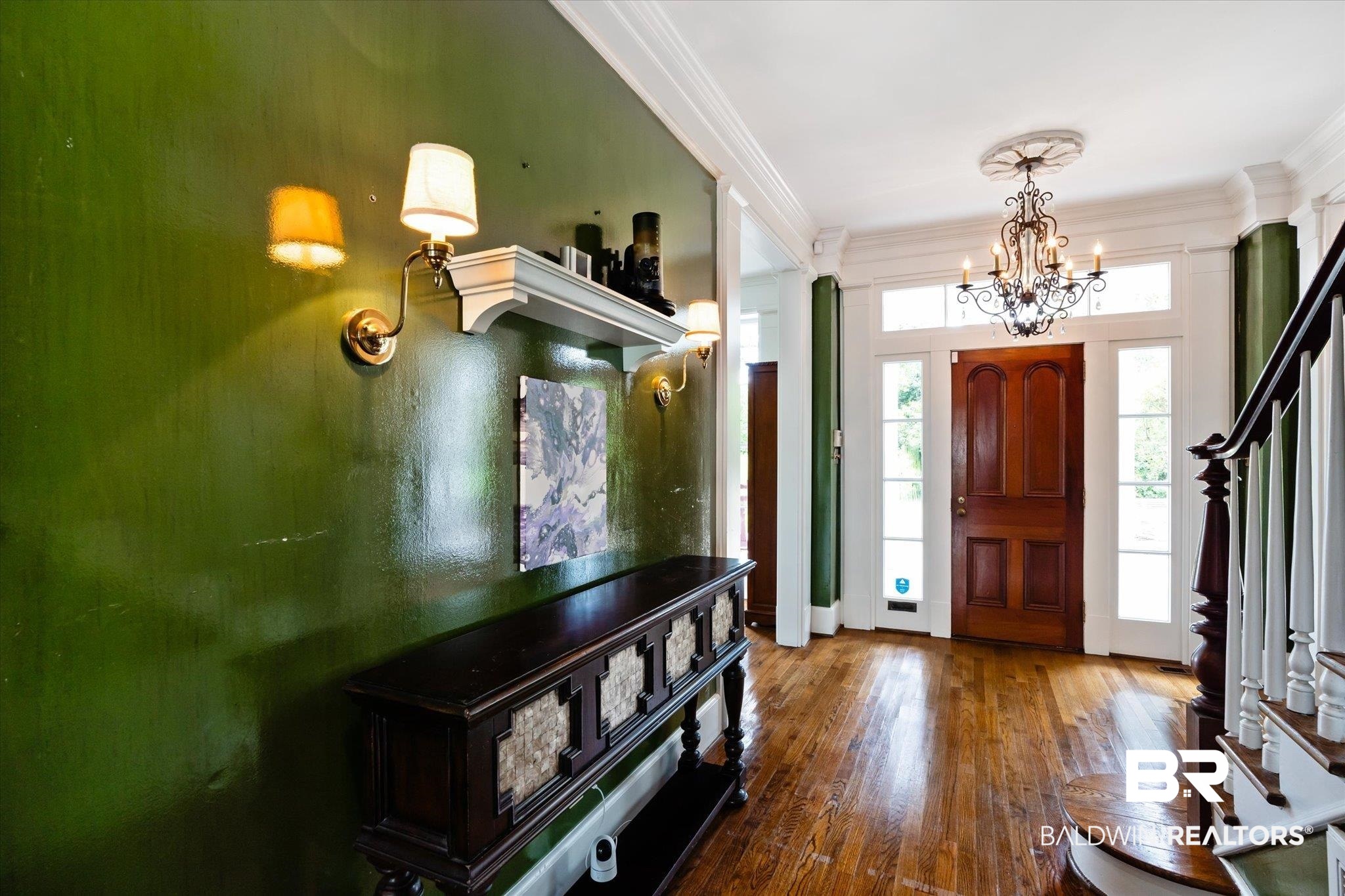 2205 Spring Hill Avenue Mobile, AL 36607 - Photo 6 of 59 Foyer entrance with a chandelier, ornamental molding, and hardwood / wood-style floors
