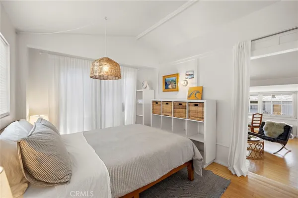 a bedroom with a bed and a cabinets
