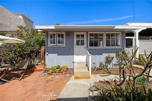 a front view of a house with a patio