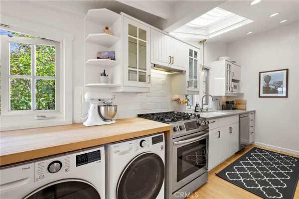 a view of kitchen sink and a stove top oven