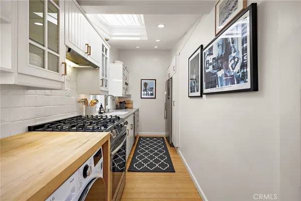 a kitchen with a stove and a cabinets