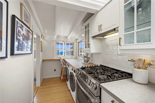 a kitchen with stainless steel appliances granite countertop a stove and a sink