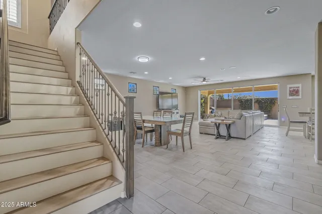a living room with furniture and a large window with outer view