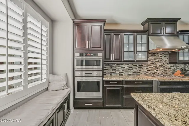 a kitchen with a stove and a sink