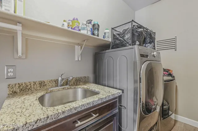 a bed room with a bed and a chair