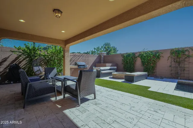 a view of a house with backyard and porch