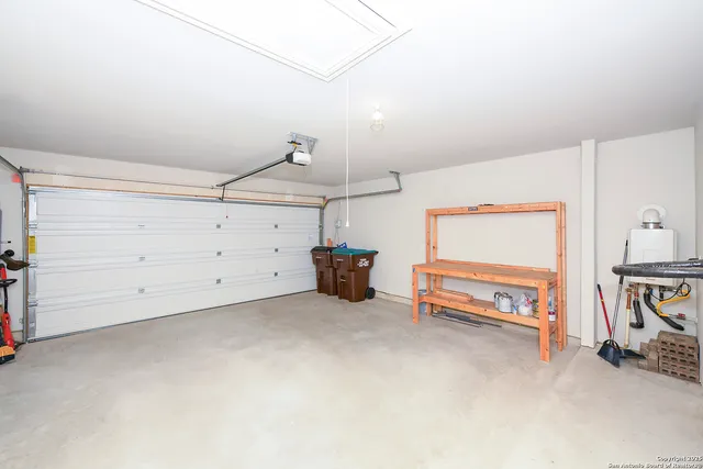 a view of a room with furniture and a chandelier