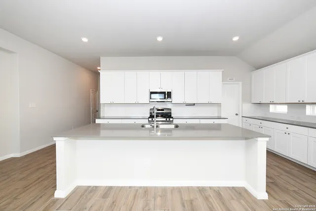a view of kitchen with wooden floor