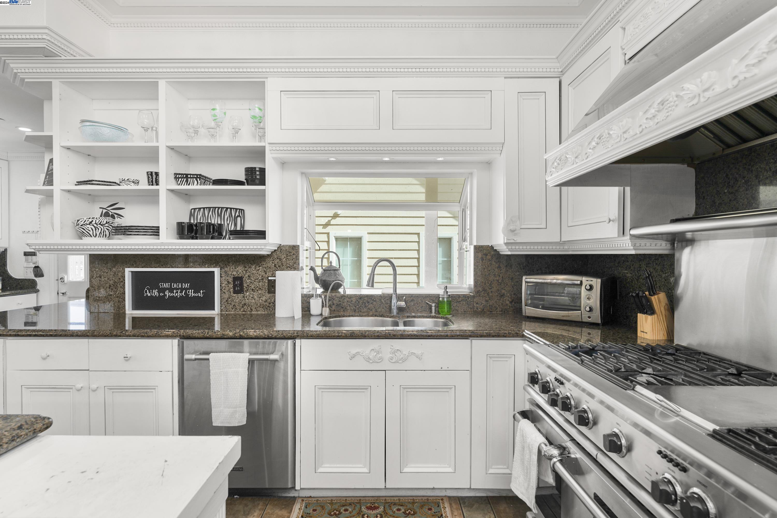 11699 Conley Road Galt, CA 95632 - Photo 13 of 31 a kitchen with stainless steel appliances granite countertop a stove and a microwave