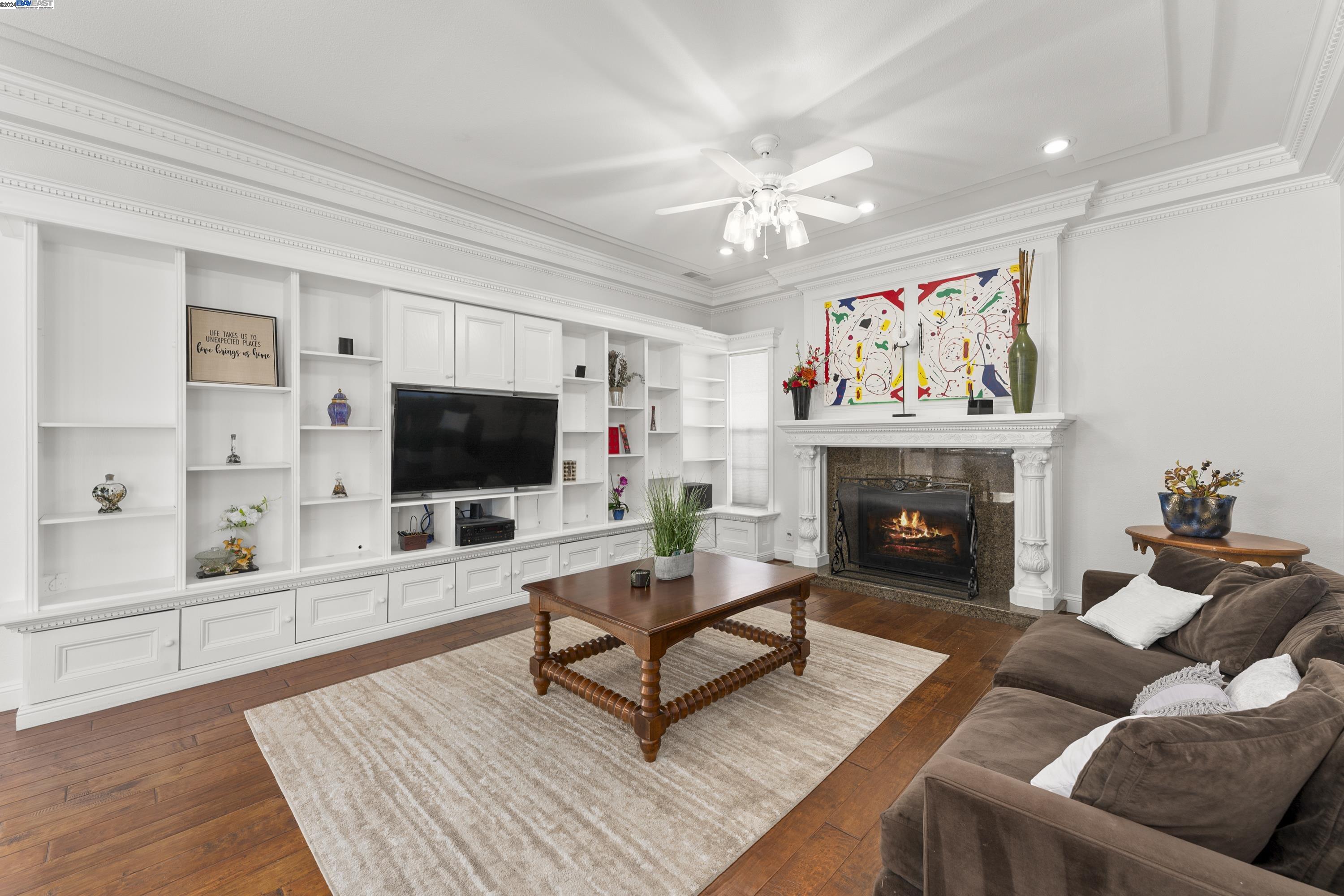 11699 Conley Road Galt, CA 95632 - Photo 15 of 31 a living room with furniture a flat screen tv and a fireplace
