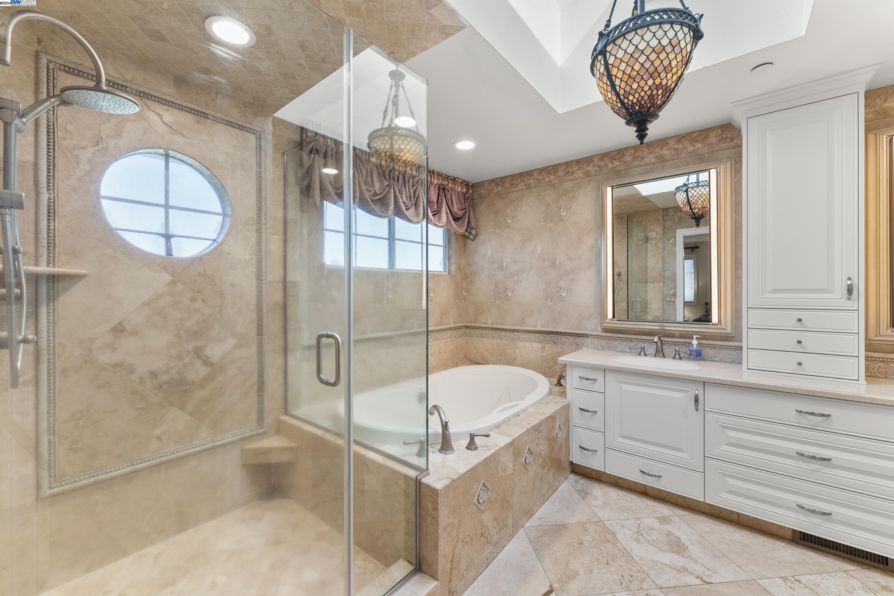 11699 Conley Road Galt, CA 95632 - Photo 18 of 31 a bathroom with a tub a sink and a shower