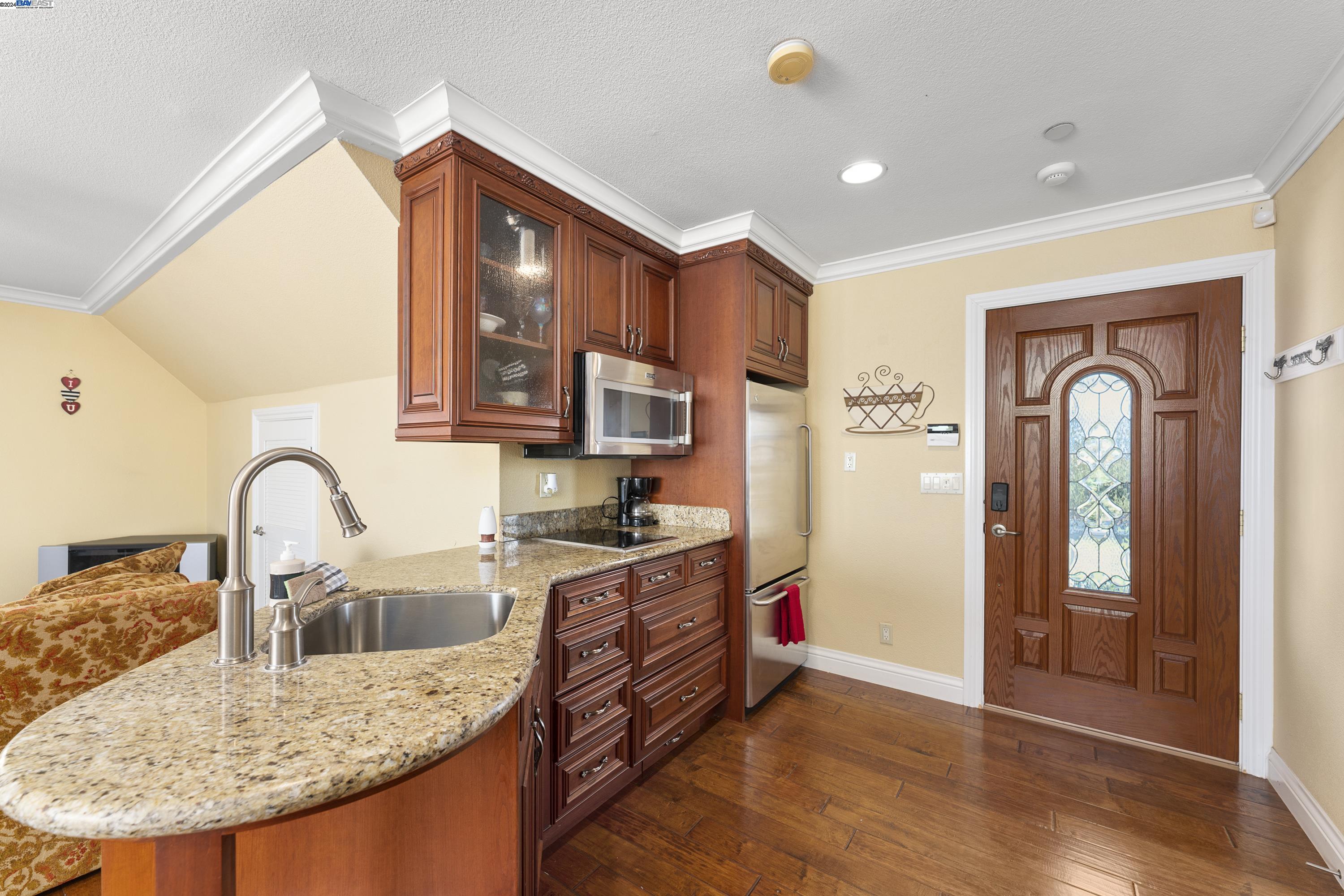 11699 Conley Road Galt, CA 95632 - Photo 22 of 31 a kitchen with stainless steel appliances granite countertop a sink a stove and a refrigerator