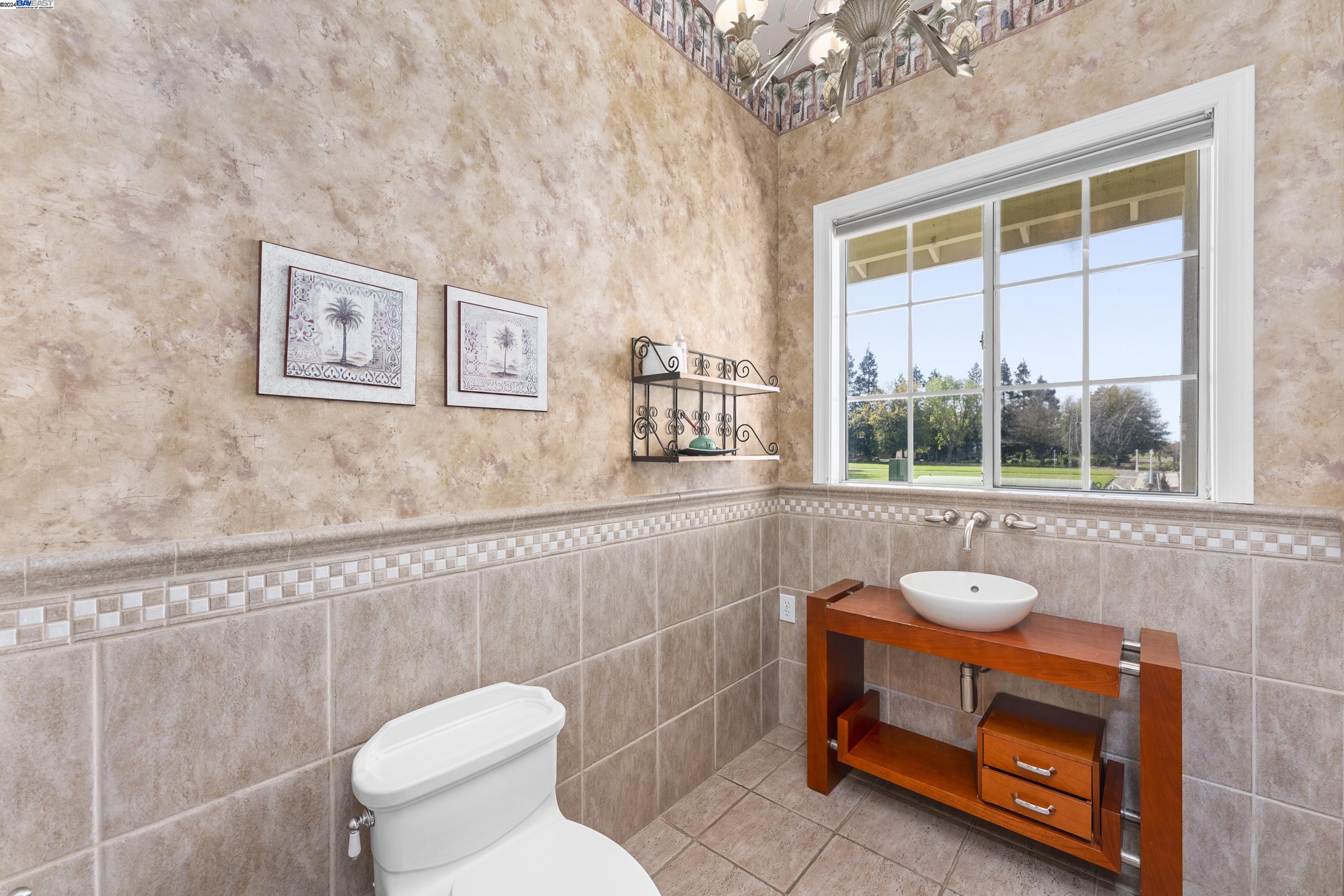 11699 Conley Road Galt, CA 95632 - Photo 25 of 31 a bathroom with a toilet sink and mirror