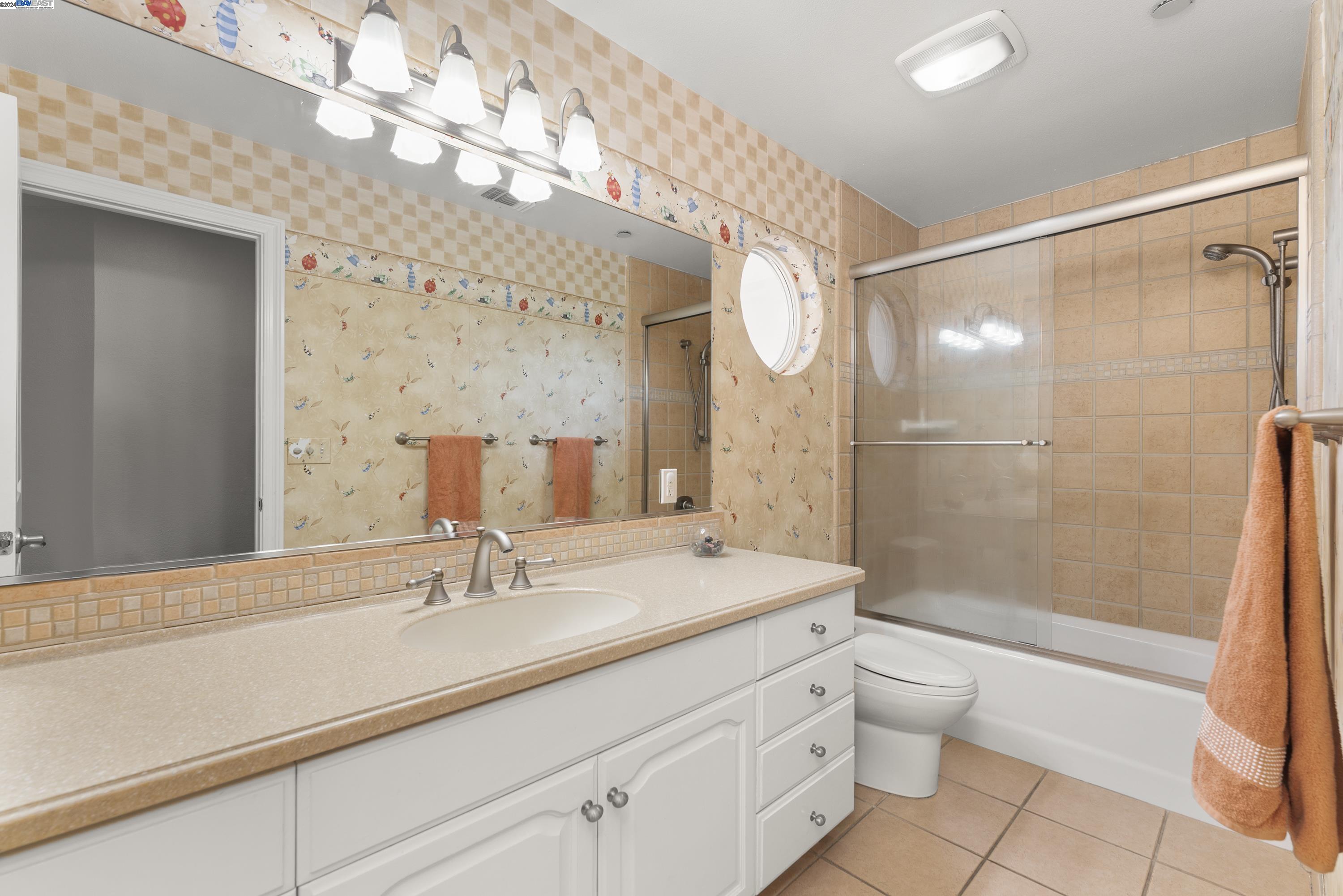 11699 Conley Road Galt, CA 95632 - Photo 28 of 31 a bathroom with a shower sink vanity mirror and toilet