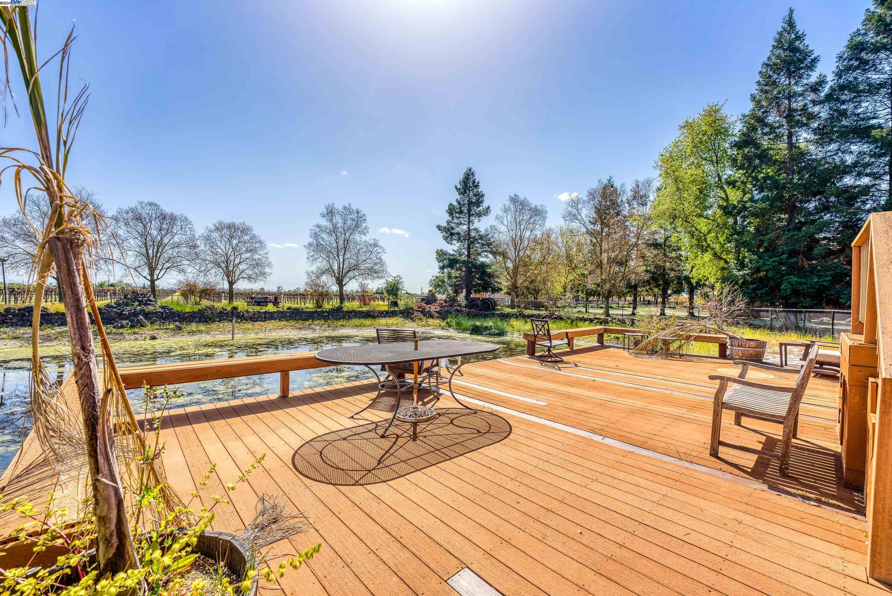 11699 Conley Road Galt, CA 95632 - Photo 30 of 31 a view of swimming pool with seating area and trees