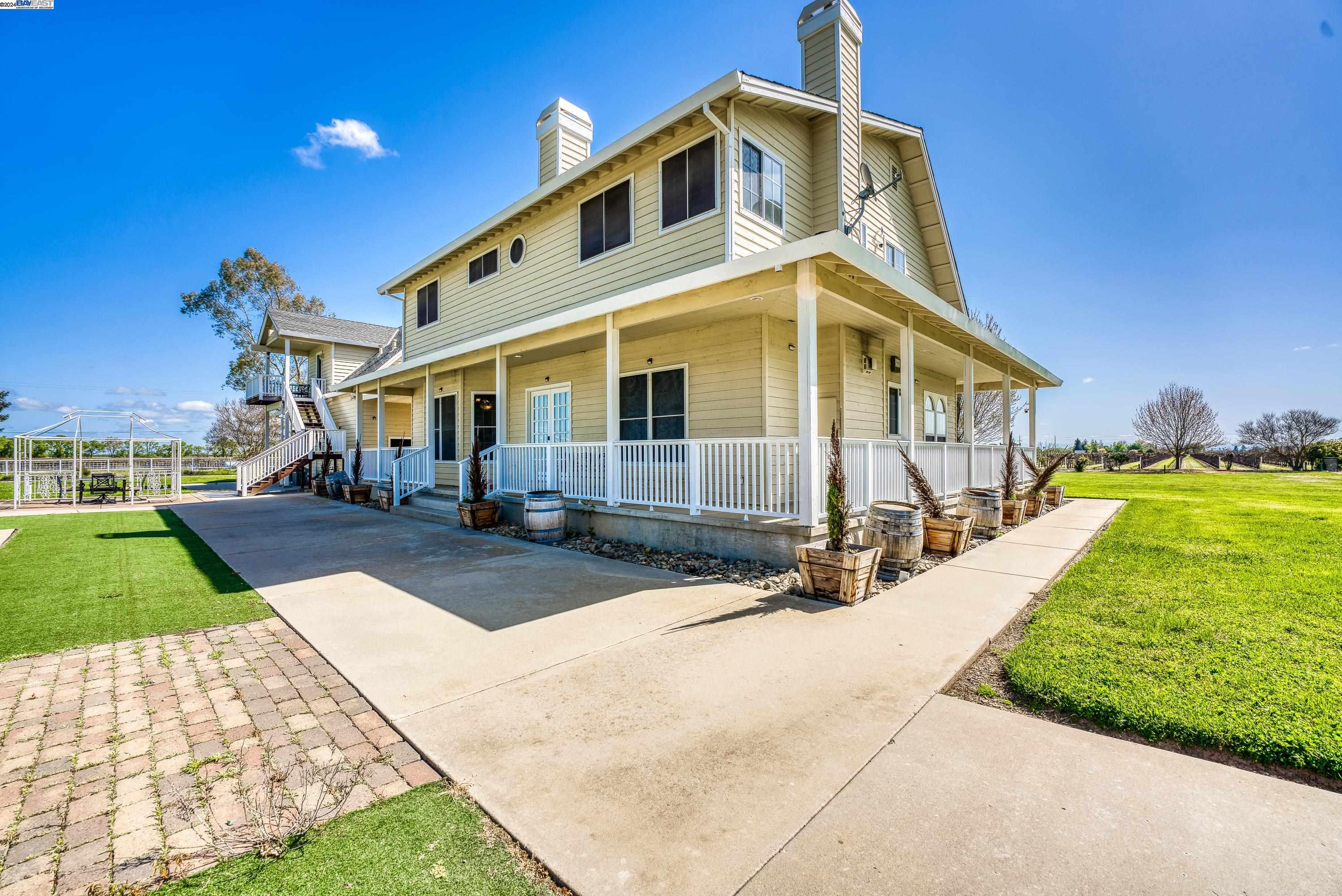 11699 Conley Road Galt, CA 95632 - Photo 3 of 31 a front view of a house with a yard