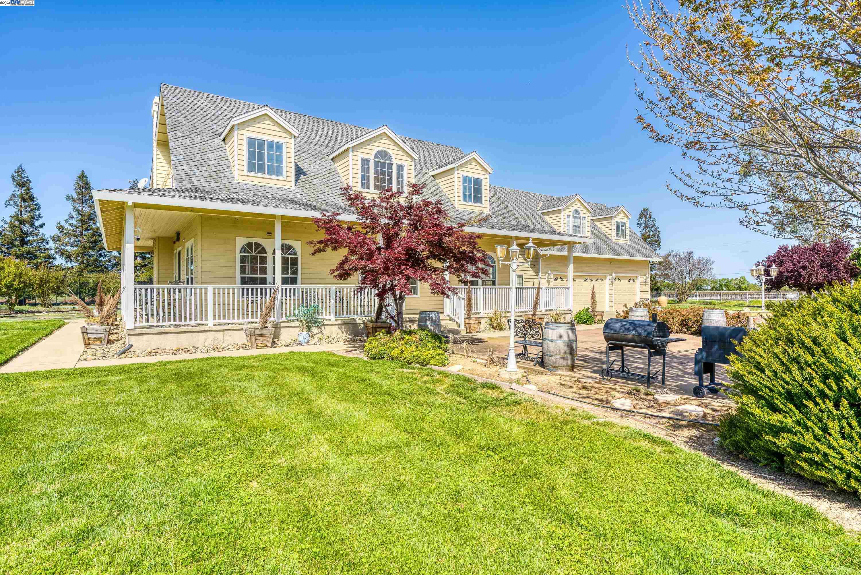 11699 Conley Road Galt, CA 95632 - Photo 4 of 31 a front view of a house with a garden and patio