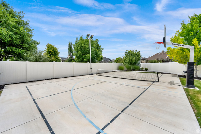 1132 South 1300th Street West Mapleton, UT 84664 - Photo 43 of 52 Outdoor sport court featuring a basketball hoop, net, and painted court lines