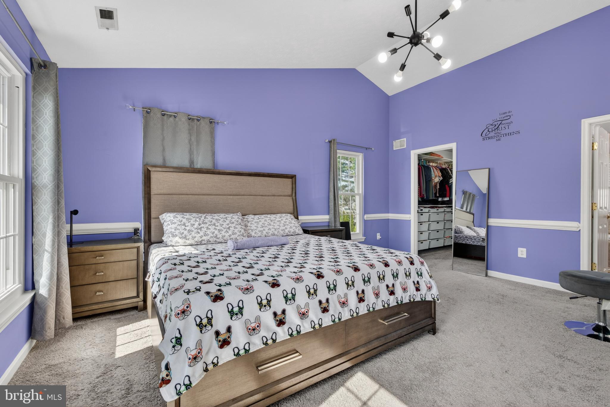 611 Hunting Ridge Drive Frederick, MD 21703 - Photo 35 of 50 a bedroom with a bed and a chandelier