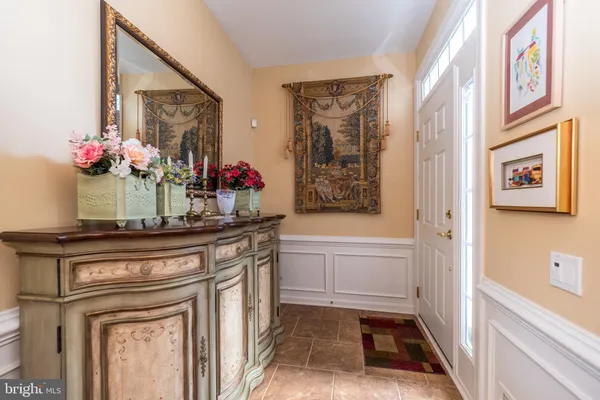 a kitchen with stainless steel appliances granite countertop a sink and dishwasher with white cabinets