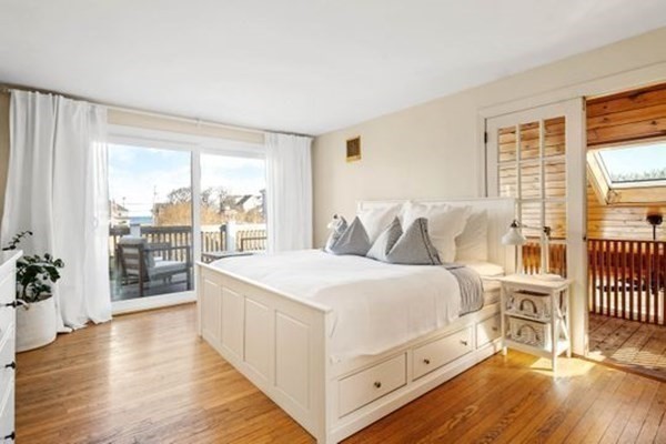 12 Mitchell Avenue Scituate, MA 02066 - Photo 23 of 30 a spacious bedroom with a bed and a large window