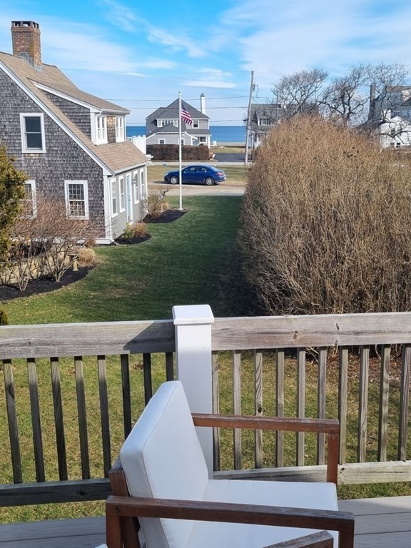 12 Mitchell Avenue Scituate, MA 02066 - Photo 27 of 30 a view of a brick house with a yard