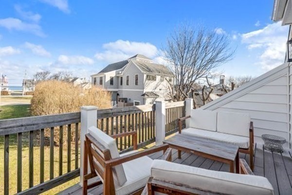 12 Mitchell Avenue Scituate, MA 02066 - Photo 28 of 30 a view of a roof deck with wooden fence and wooden floor