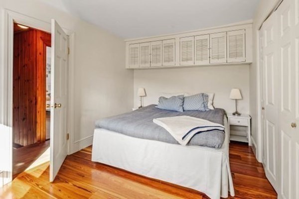 12 Mitchell Avenue Scituate, MA 02066 - Photo 29 of 30 a bedroom with a bed and wooden floor