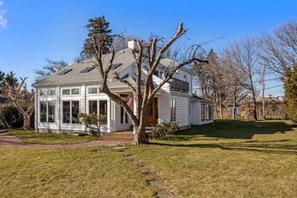 12 Mitchell Avenue Scituate, MA 02066 - Photo 4 of 30 a backyard of a house with yard and outdoor seating