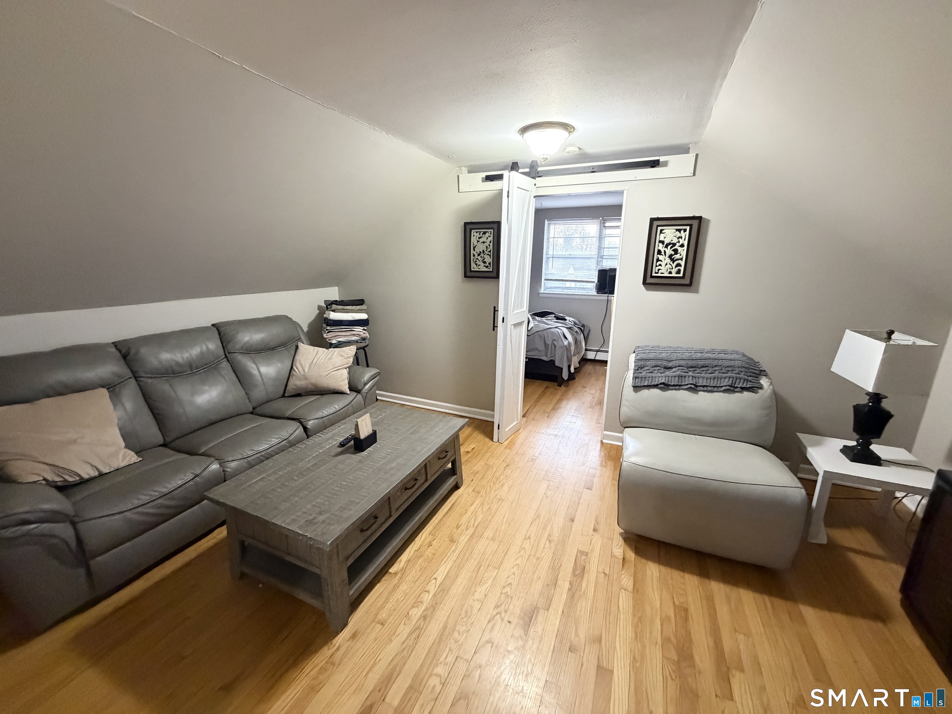 100 Upton Street, Unit 5 New Britain, CT 06051 - Photo 4 of 6 a living room with furniture and a couch