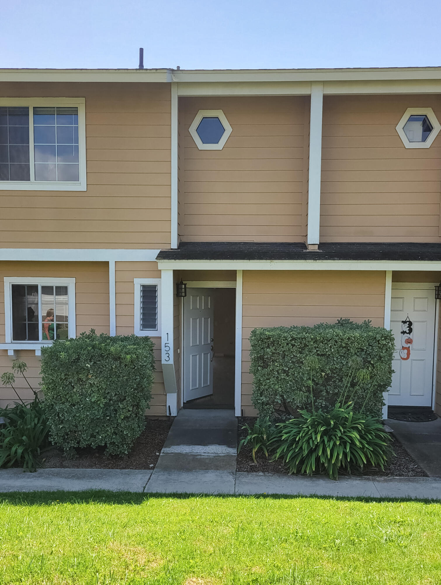 a front view of a house with garden