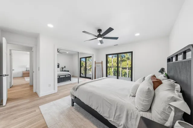 a bedroom with a bed and a chair