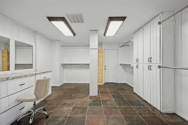 a bathroom with a mirror and a shower