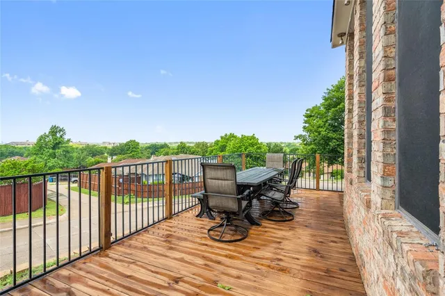 a view of balcony with furniture and wooden floor