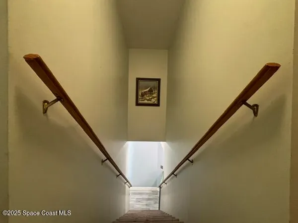 a view of a living room with clothes and shoes