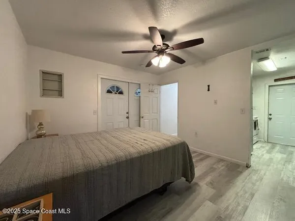 a kitchen with a refrigerator and cabinets