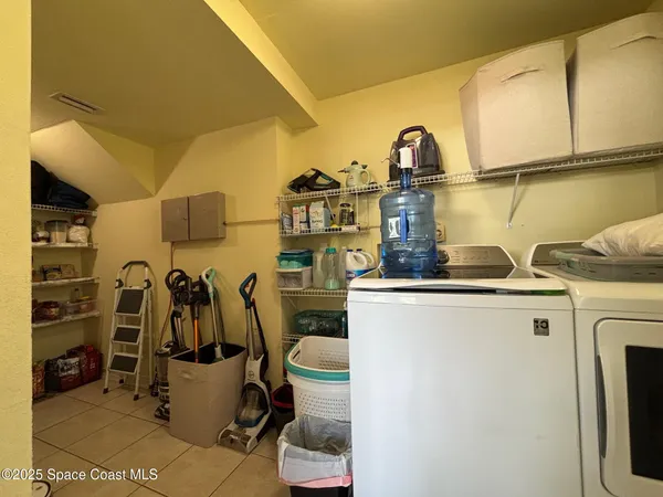 a view of a storage room with washer and dryer