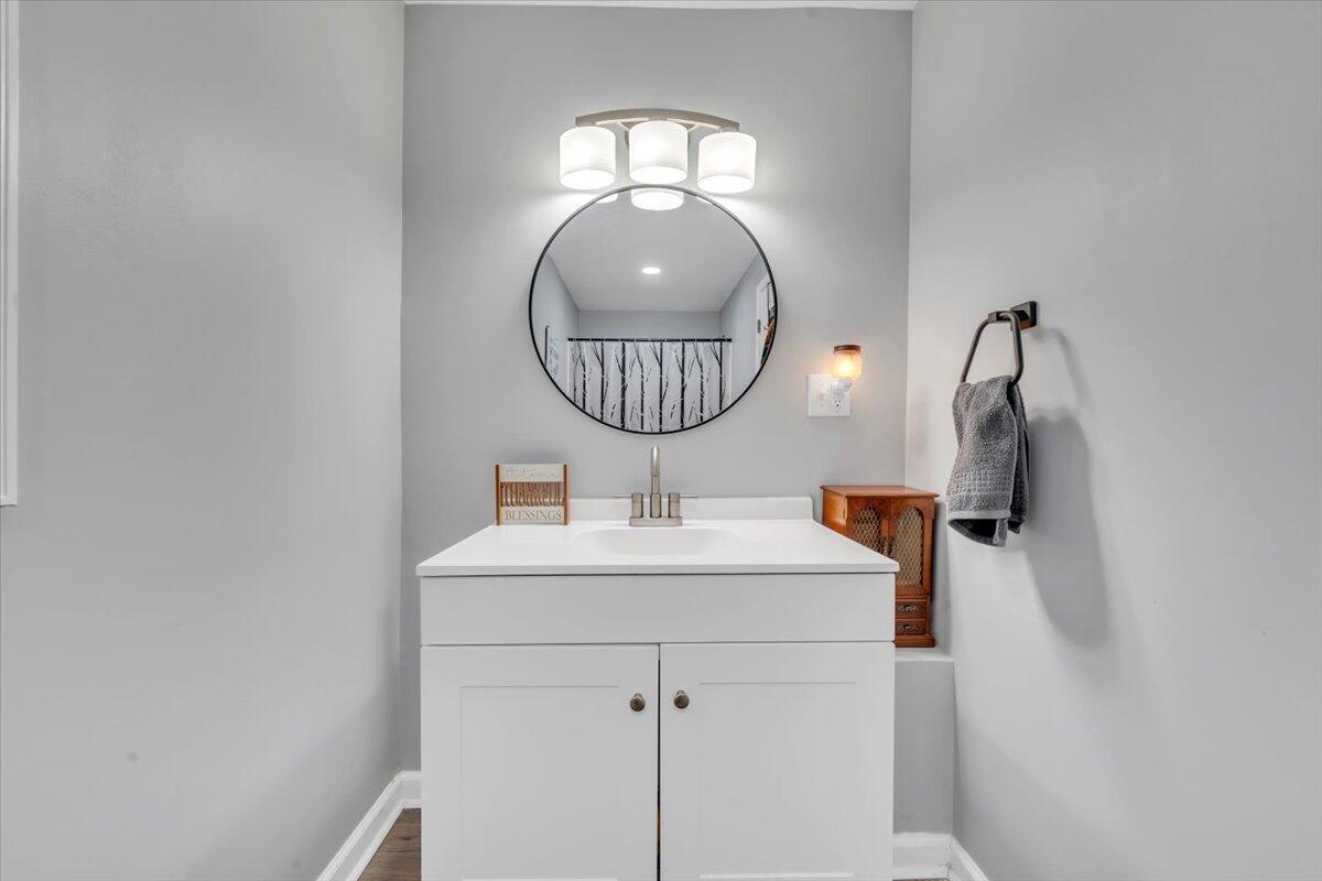 1178 Preston Mill Road Huddleston, VA 24104 - Photo 11 of 28 a bathroom with a sink and mirror