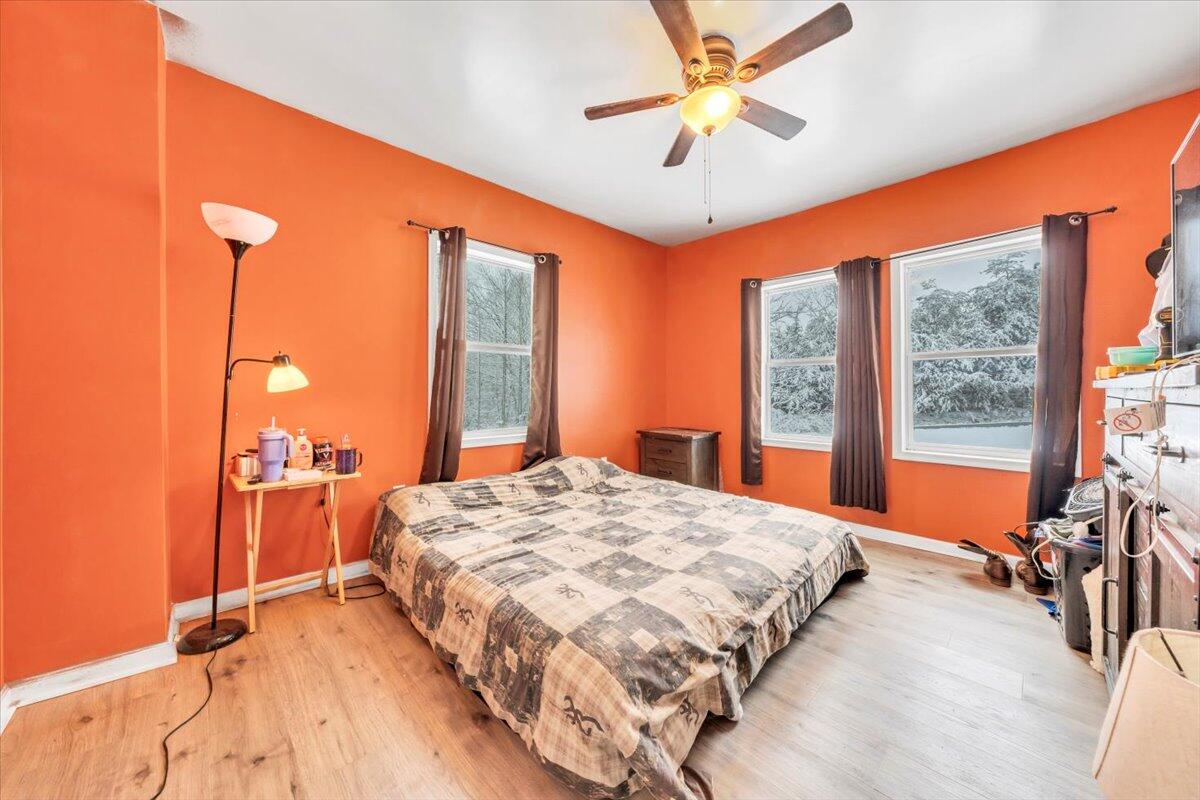 1178 Preston Mill Road Huddleston, VA 24104 - Photo 13 of 28 a bed room with a bed and a large window