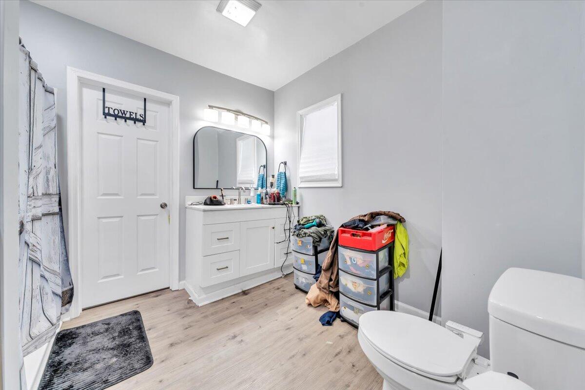 1178 Preston Mill Road Huddleston, VA 24104 - Photo 15 of 28 a bathroom with a toilet sink vanity