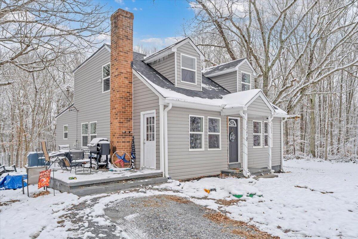 1178 Preston Mill Road Huddleston, VA 24104 - Photo 24 of 28 a view of a white house with large outdoor space and a car parked side of it