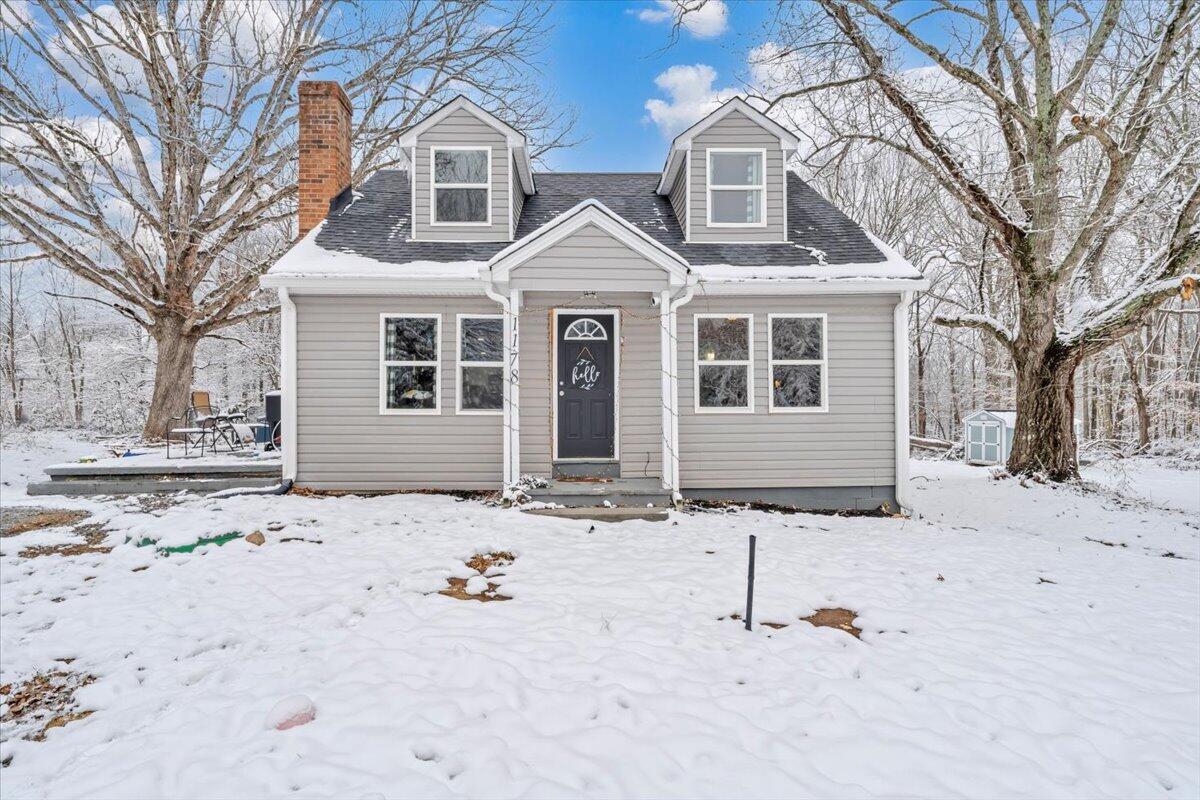 1178 Preston Mill Road Huddleston, VA 24104 - Photo 26 of 28 a front view of a house with a yard covered in snow