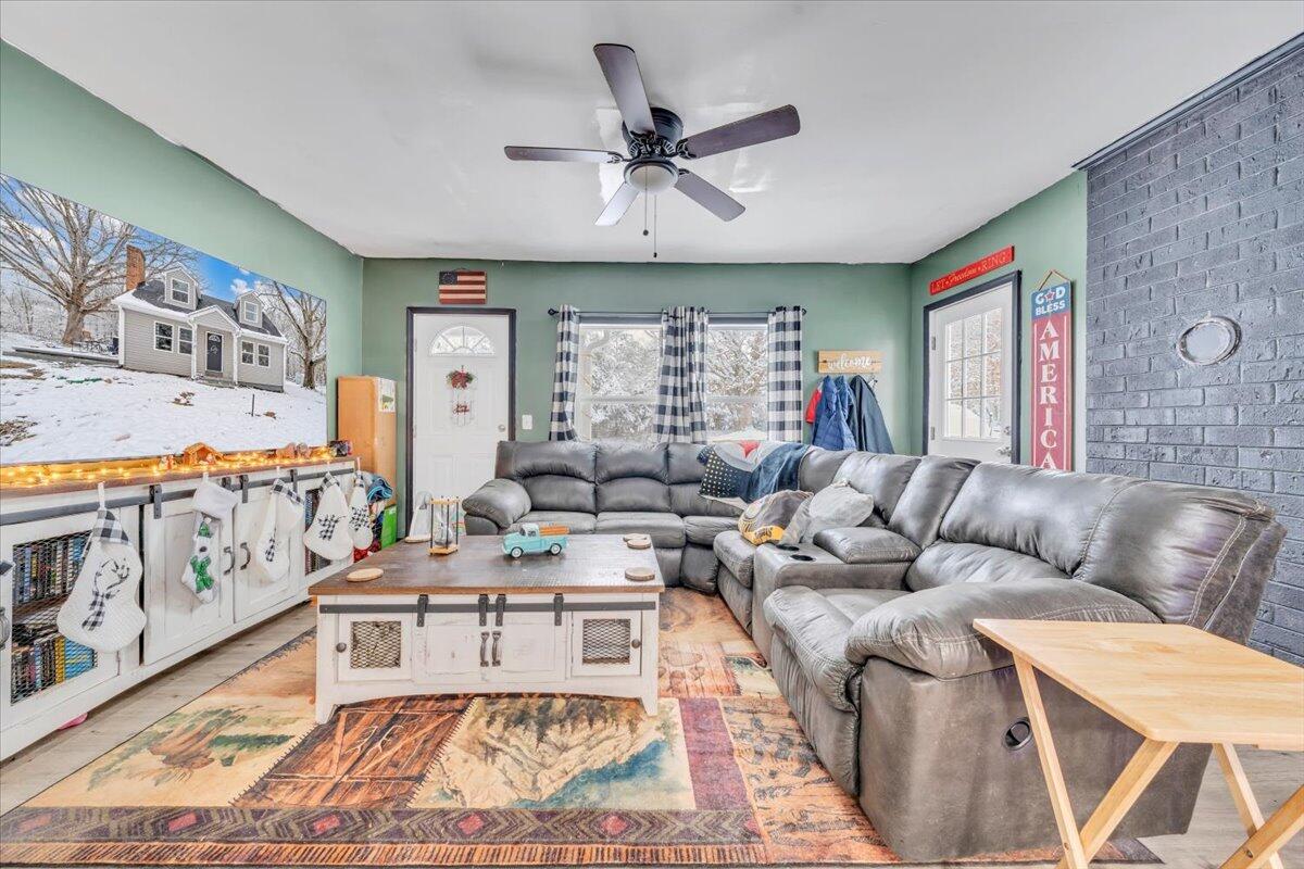 1178 Preston Mill Road Huddleston, VA 24104 - Photo 4 of 28 a living room with furniture a large window and a rug