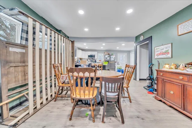 a dining room with furniture and window