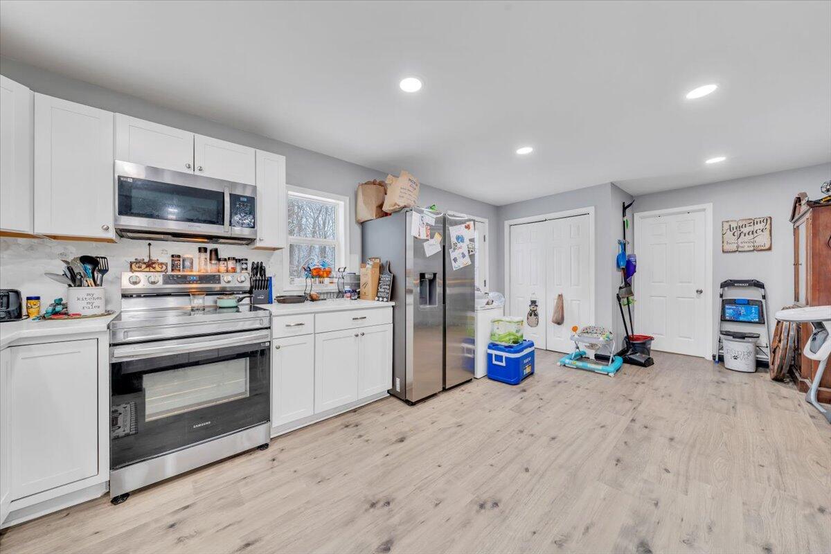 1178 Preston Mill Road Huddleston, VA 24104 - Photo 10 of 28 a kitchen with a refrigerator and a sink